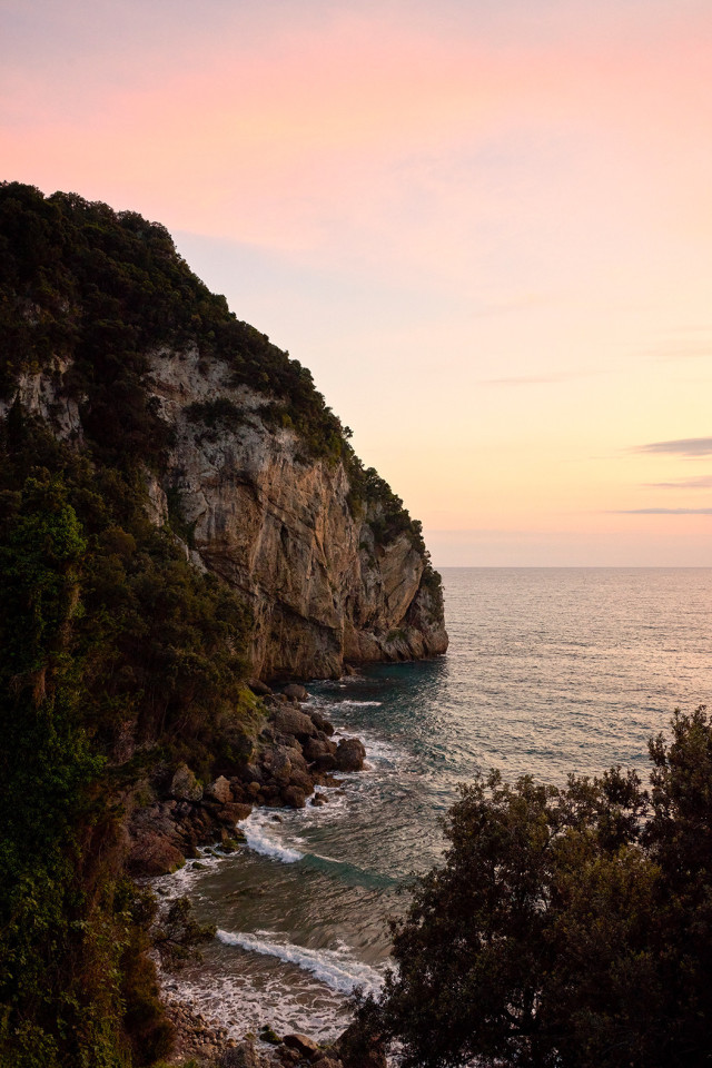 cove surrounded by rugged hills in corfu
