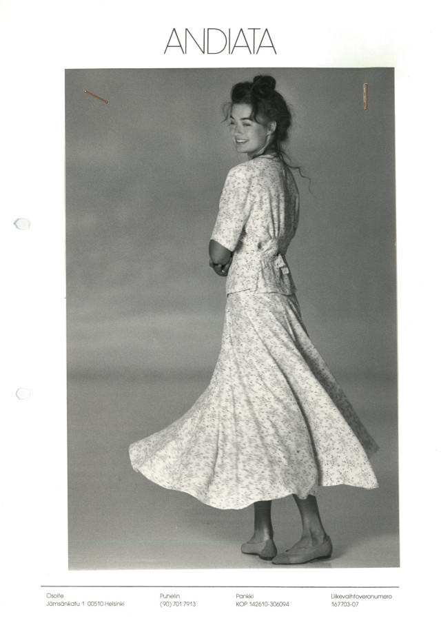 black-and-white photo of model in floral skirt and matching top