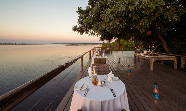 dinner tables on deck area at chobe game lodge