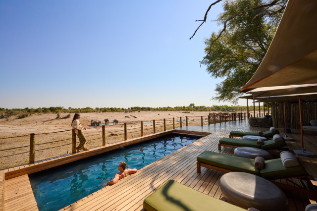 savute lodge exterior plunge pool with decking and sun loungers
