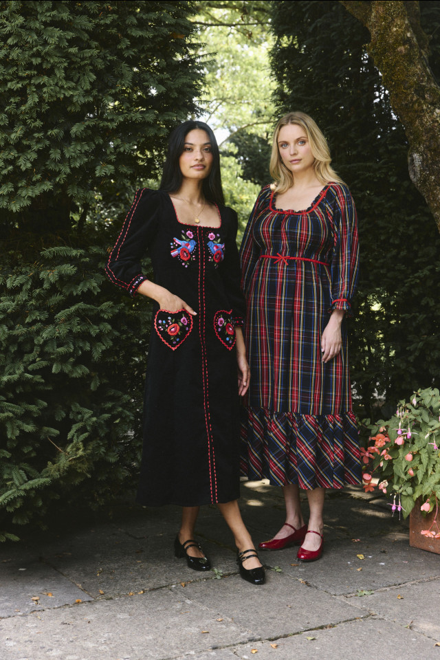 two models posing in dresses and ballet flats