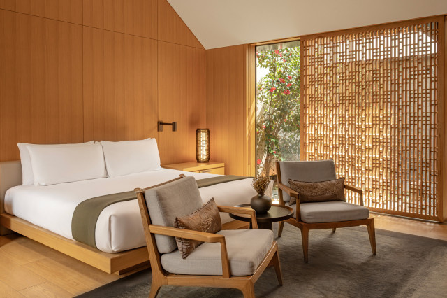hotel suite in luxurious hotel with white bed linen and netural tones