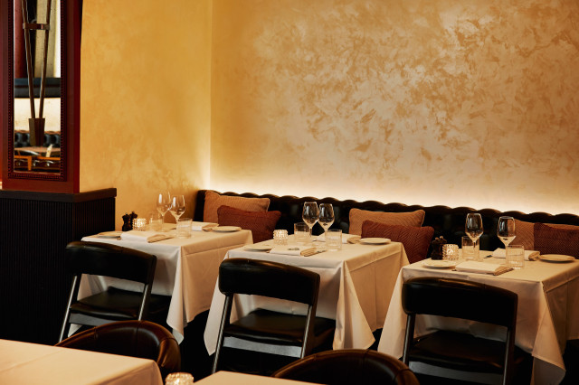 restaurant interiors with warm accents and leather chairs