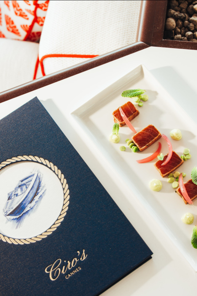 slices of tuna served on rectangular plate in hotel restaurant 