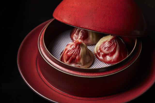 dumplings served in red dish 