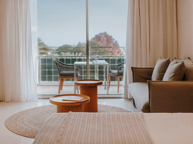 junior suite with pool view at aguas de ibiza