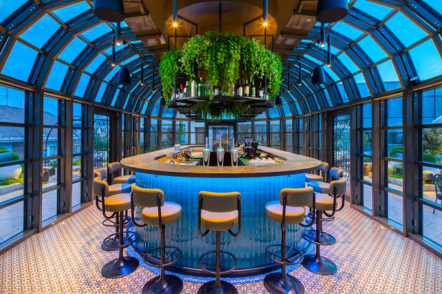 kimpton bem budapest skybar with blue accents and hanging plants