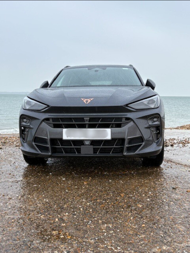 front picture of car parked beside sea