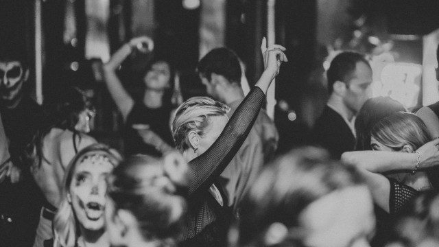 group of people dancing in bar 