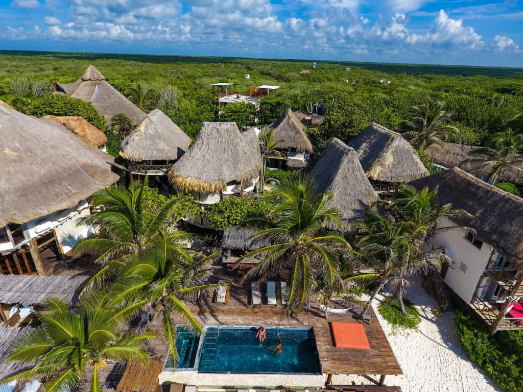 Aerial view of luxury resort swimming pool in Amansala, Zona Hotelera, Mexico