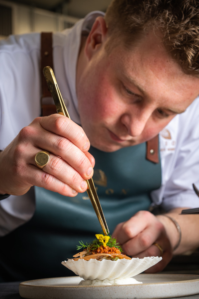 photo of alex webb at his restaurant, orion