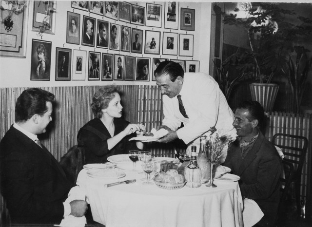 black and white photo of people in restaurant in Rome