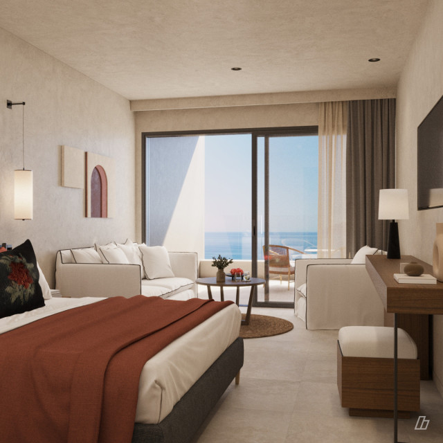 interior of hotel suite with double bed and white sofa and chair