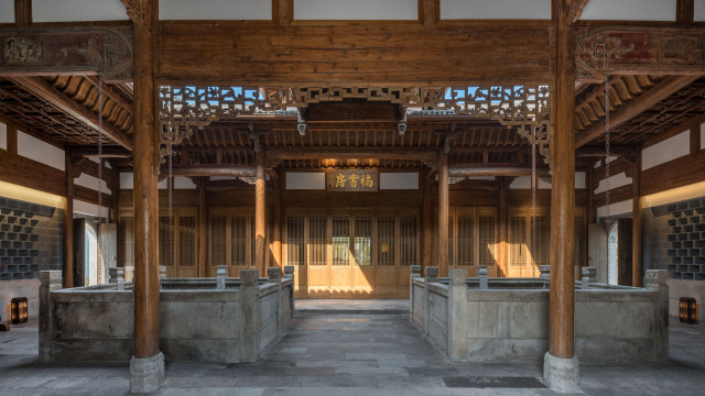 hotel's cultural centre in shanghai with wooden beams and stone paving slabs