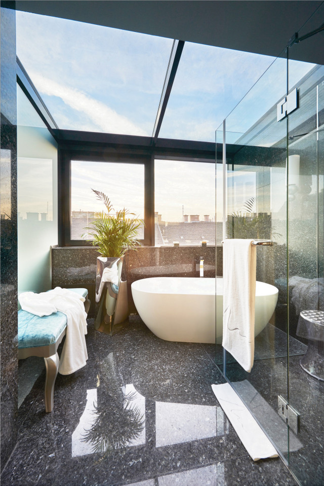 hotel aria bathroom with large windows 