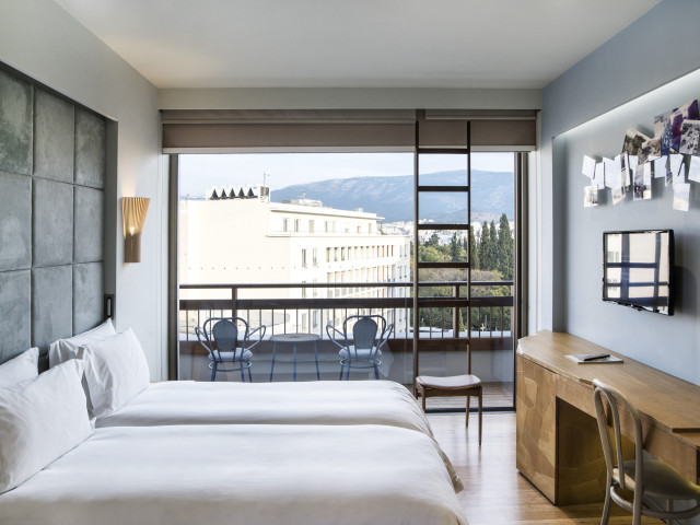 studio room with twin beds inside hotel 