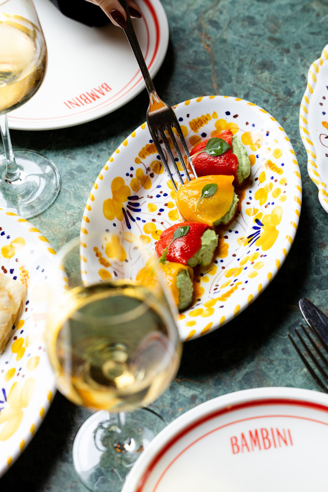 small stuffed peppers on colourful plate