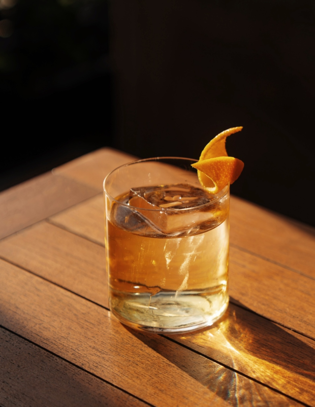 negroni on wooden table at bar antoine