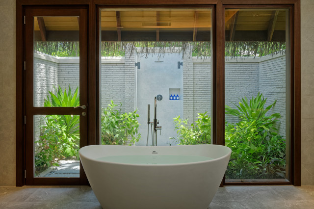 hotel bathroom with free-standing bathtub