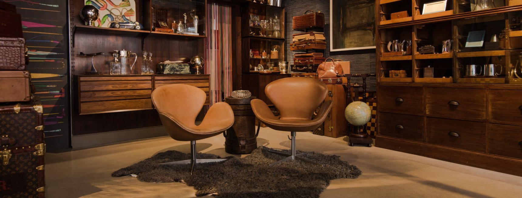 2 tan leather chairs in a living room