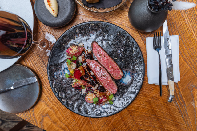 meat dish served in restaurant on wooden table