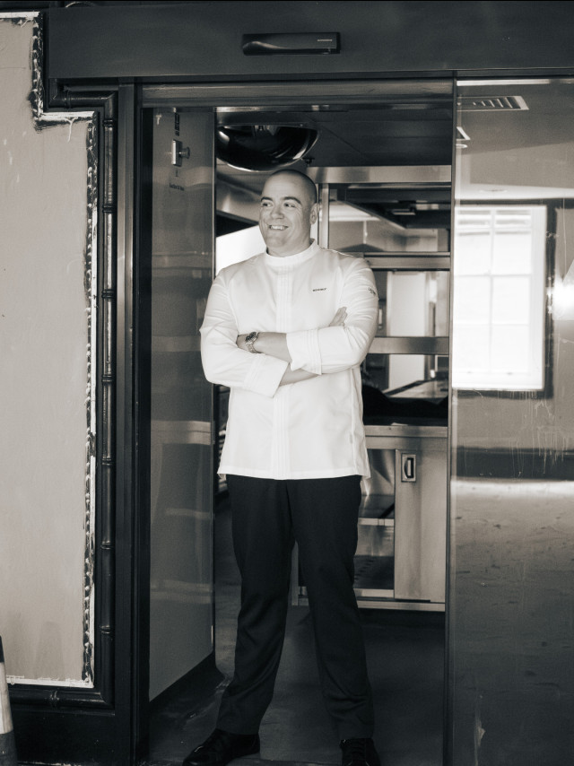 matt abe standing with arms crossed