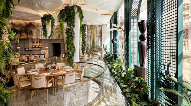 hotel restaurant with plants and green tones