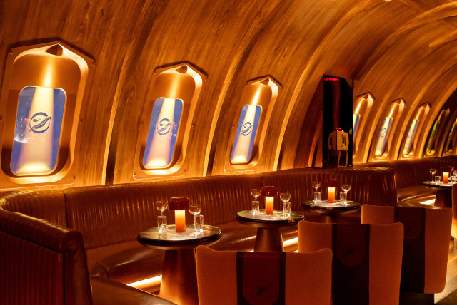 interior photo of bar with orange and leather seats 