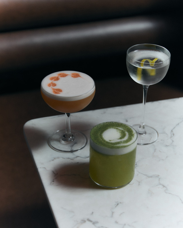 three cocktails on marble table