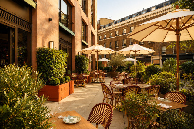 outdoor restaurant terrace area with wicker seating