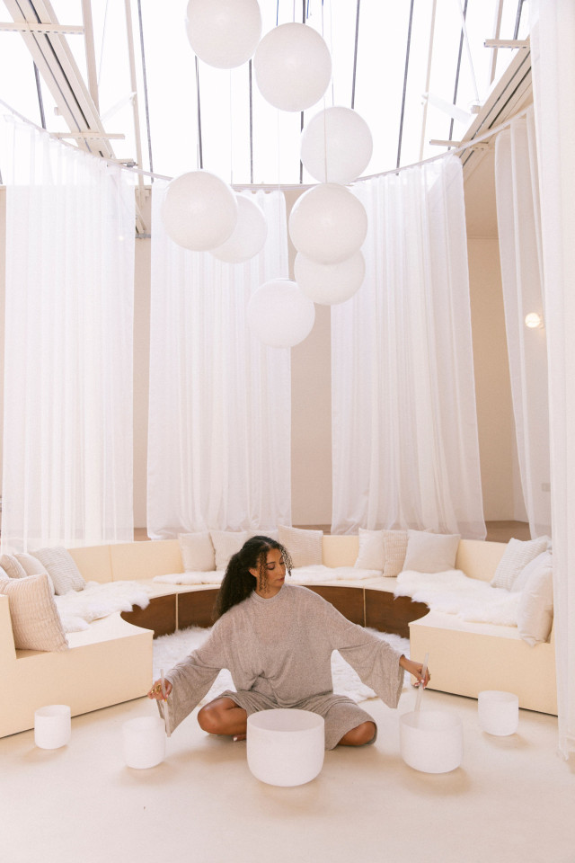 sound healing teacher in white room