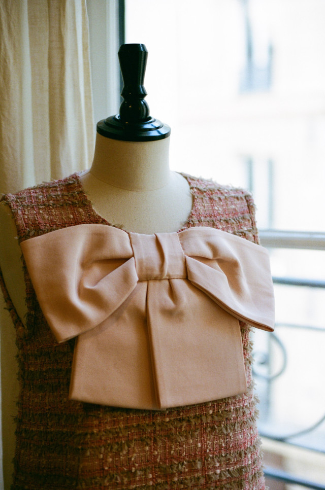 pink tweed dress with large bow on front