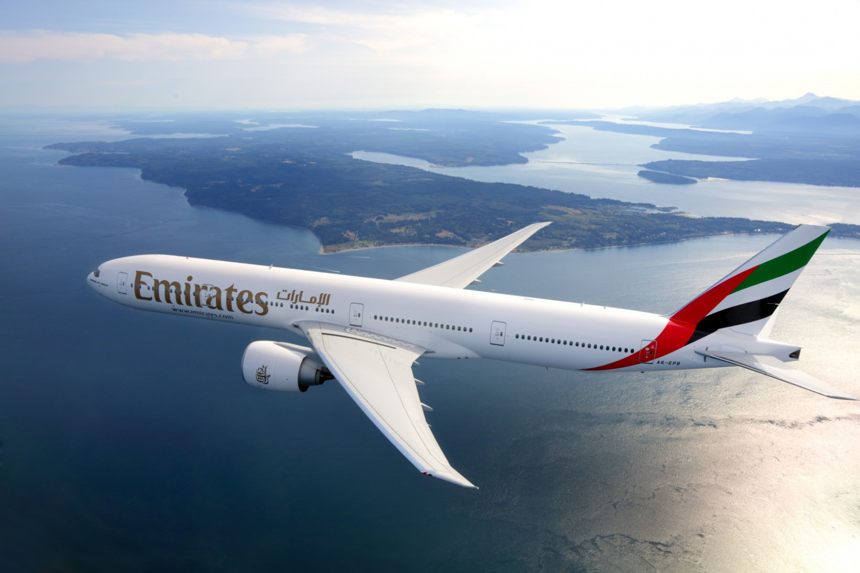 Emirates jumbo jet flying
