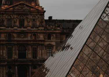 The Louvre on a dark cloudy day.