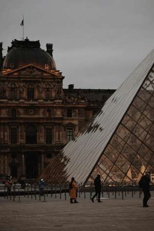 The Louvre on a dark cloudy day.