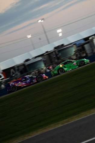 Cars racing on the Daytona International Speedway.
