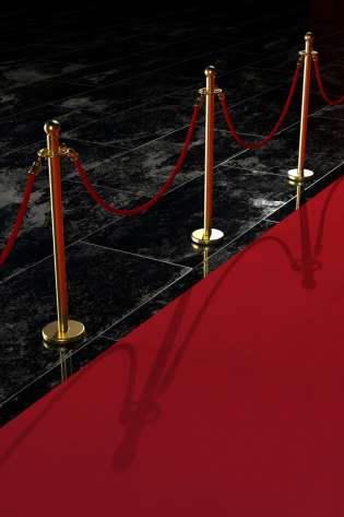 Red carpet with railings.