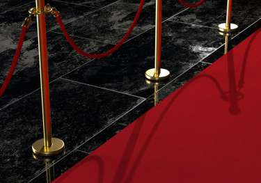 Red carpet with railings.