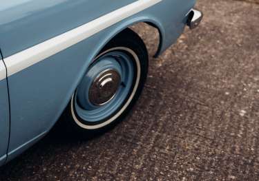 Parked blue vintage car.