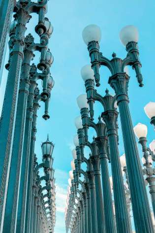 3 rows of many light posts outside LACMA.