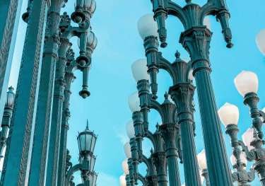 3 rows of many light posts outside LACMA.