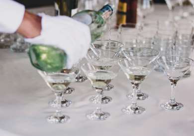Cocktails being poured .