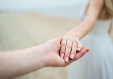 Couple holding hands.