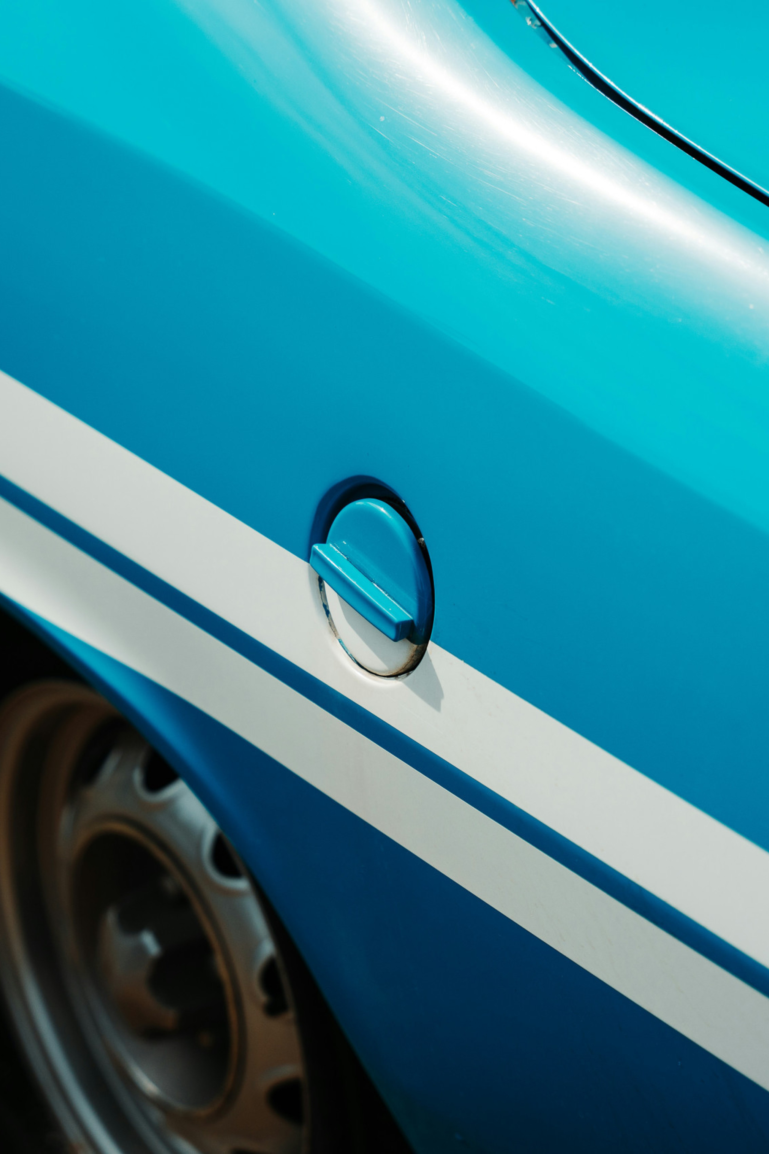 blue car with white stripes
