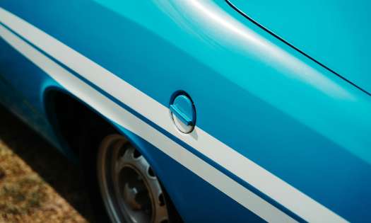 Blue car with white stripes.