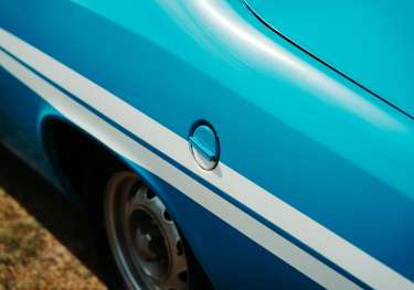 Blue car with white stripes.
