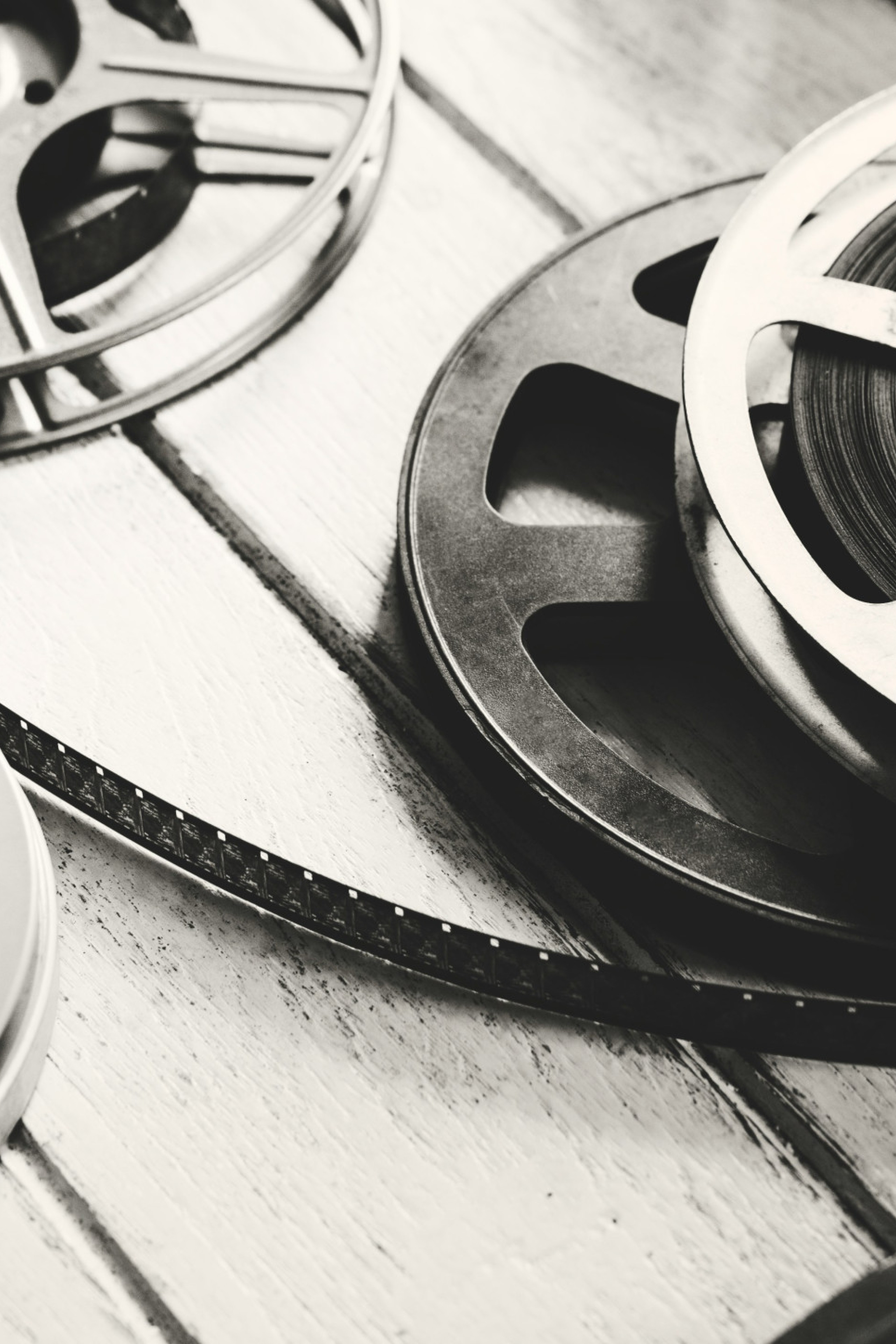 vintage film reels on wooden table