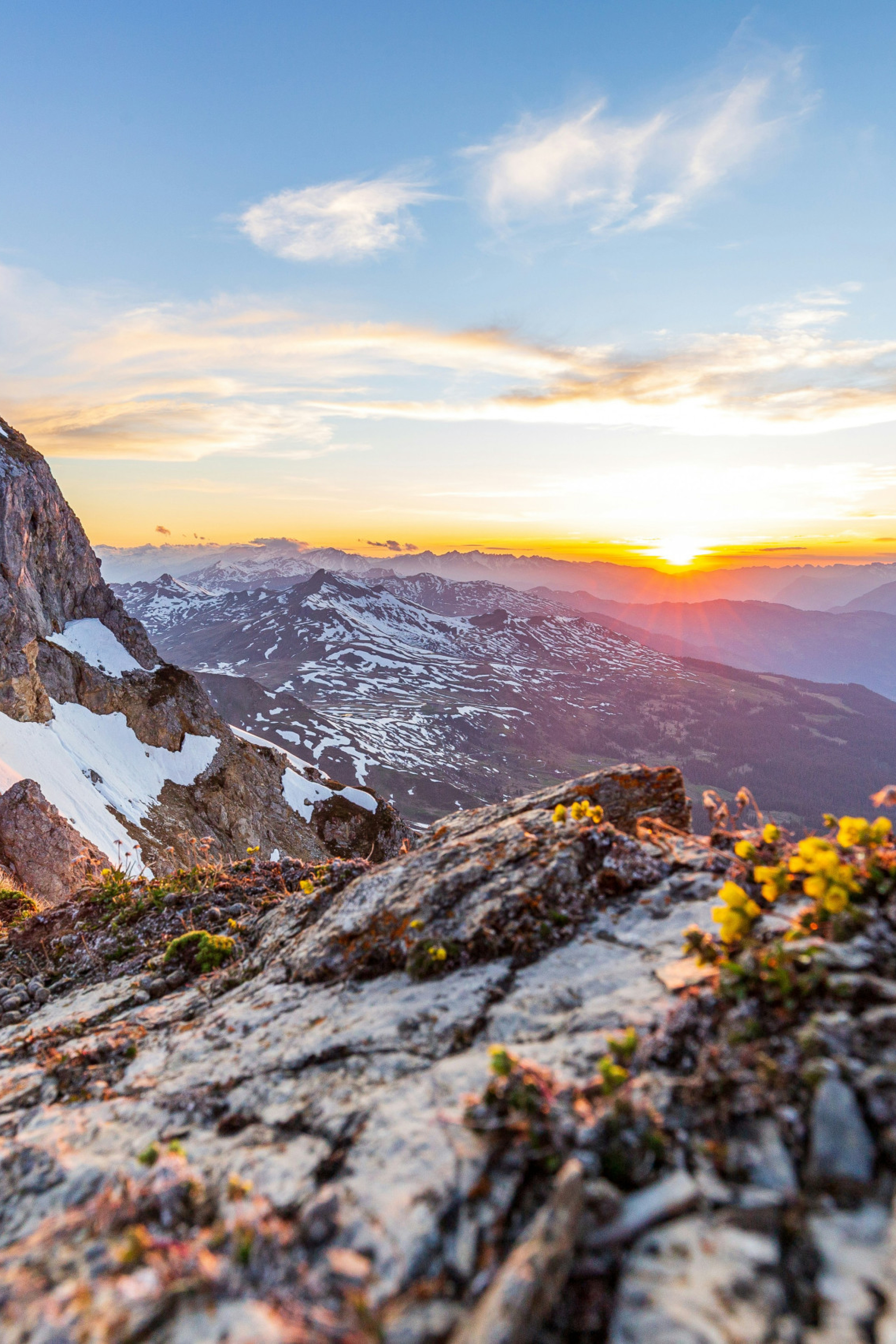 the top of a mountain in Davos-Klosters, Switzerland during sunset