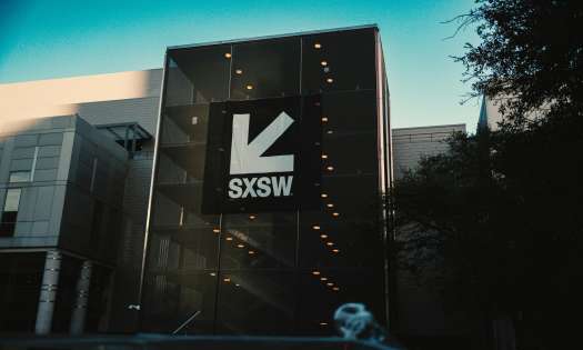 Convention centre entrance with SXSW logo banner.