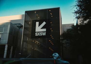 Convention centre entrance with SXSW logo banner.